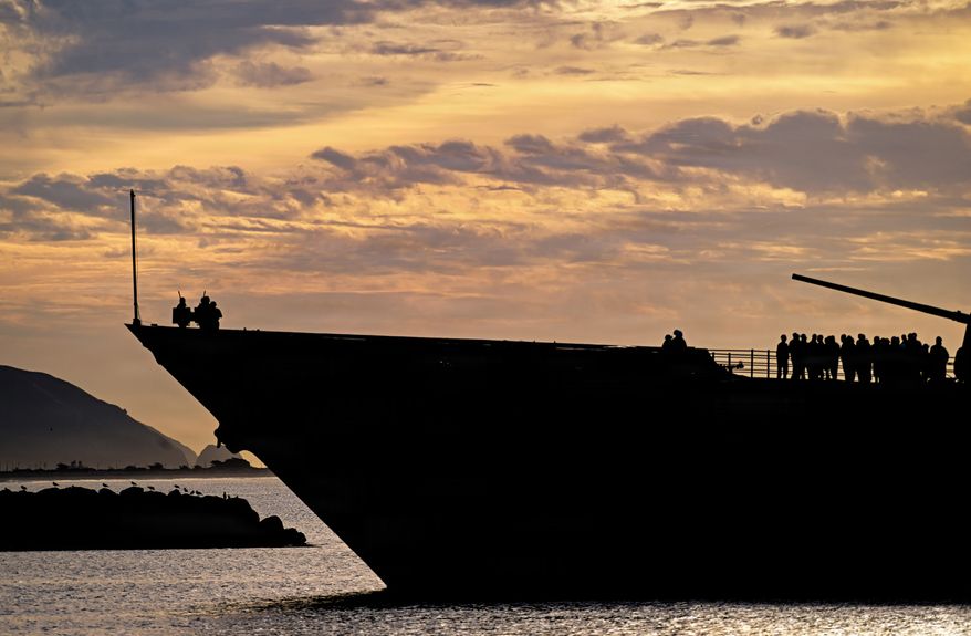 Guided-missile cruiser USS Chosin (CG 65) is silhouetted by the sunrise as it approaches the Port of Hueneme on Jan. 26, 2026. U.S. Navy cruisers are designed to provide air and surface protection for carrier strike groups, utilizing advanced missile systems like the Aegis Combat System. USS Chosin, a Ticonderoga-class guided-missile cruiser, was commissioned in 1991 and is homeported in San Diego. (U.S. Navy photo by Dana Rene White)