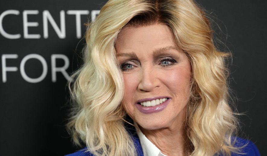 Donna Mills poses at the premiere of the documentary film "Bob Mackie: Naked Illusion" at the Directors Guild of America, Monday, May 13, 2024, in Los Angeles. (AP Photo/Chris Pizzello)
