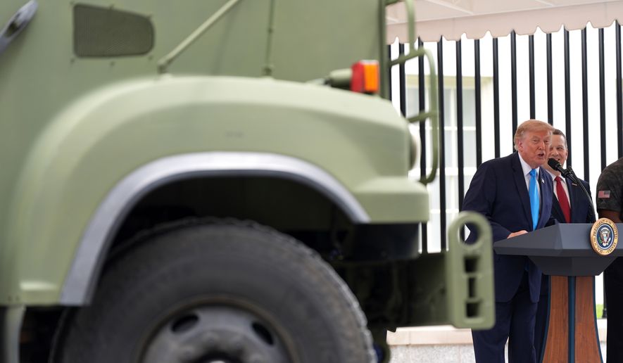 President Donald Trump speaks alongside a semi truck during an event to announce the Freedom Haulers initiative at the White House, Thursday, July 30, 2026, in Washington. (AP Photo/Alex Brandon)