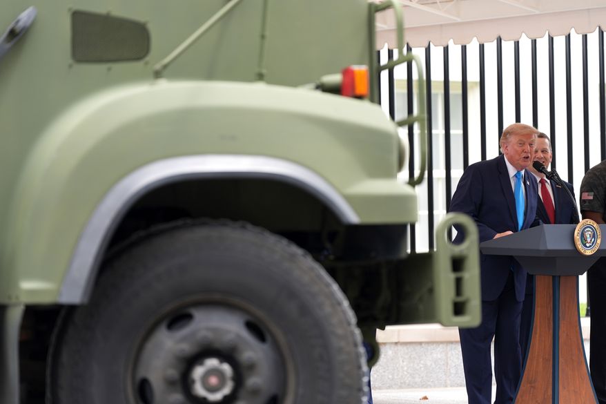 President Donald Trump speaks alongside a semi truck during an event to announce the Freedom Haulers initiative at the White House, Thursday, July 30, 2026, in Washington. (AP Photo/Alex Brandon)