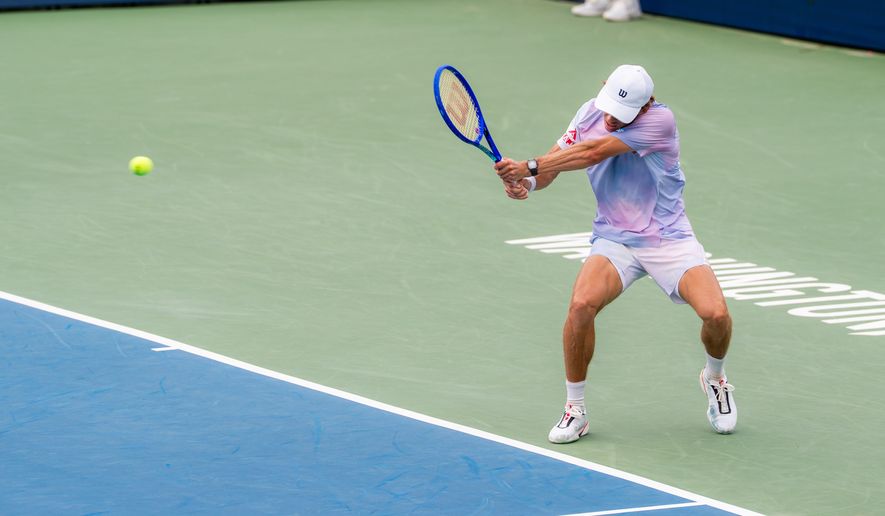 Alex de Minaur of Australia returns a ball against Cruz Hewitt of Australia in a second round match at the DC Open tennis tournament in Washington, D.C., Thursday, July 30, 2026. (All-Pro Reels)