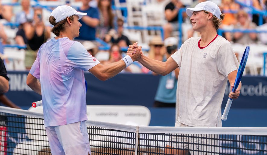 Top seed Alex de Minaur (left) and Cruz Hewitt (right), both of Australia, share a handshake after their second round match at the DC Open tennis tournament in Washington, D.C., Thursday, July 30, 2026. (All-Pro Reels)