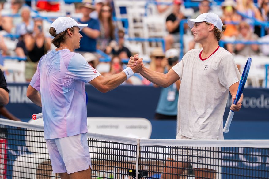 Top seed Alex de Minaur (left) and Cruz Hewitt (right), both of Australia, share a handshake after their second round match at the DC Open tennis tournament in Washington, D.C., Thursday, July 30, 2026. (All-Pro Reels)