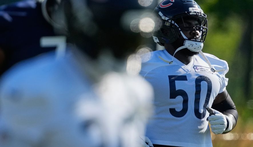 Chicago Bears defensive line Grady Jarrett works out with teammates during practice at the team's NFL football training camp, Thursday, July 30, 2026, in Lake Forest, Ill. (AP Photo/Nam Y. Huh)