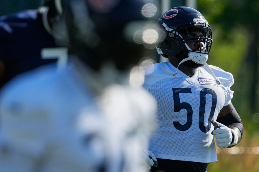 Chicago Bears defensive line Grady Jarrett works out with teammates during practice at the team's NFL football training camp, Thursday, July 30, 2026, in Lake Forest, Ill. (AP Photo/Nam Y. Huh)