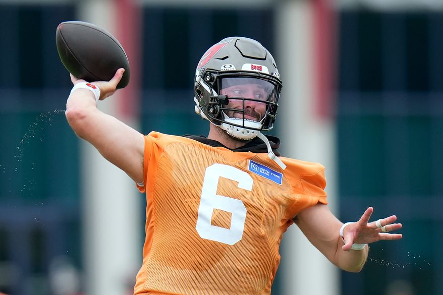 Tampa Bay Buccaneers quarterback Baker Mayfield throws a pass during an NFL football training camp practice Thursday, July 30, 2026, in Tampa, Fla. (AP Photo/Chris O'Meara)