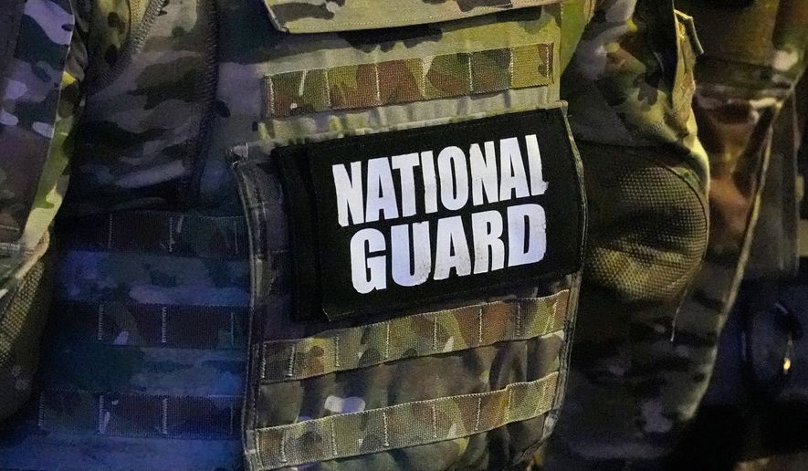 FILE - A member of the National Guard stands watch on Beale St., July 17, 2026, in Memphis, Tenn. (AP Photo/George Walker IV, File)