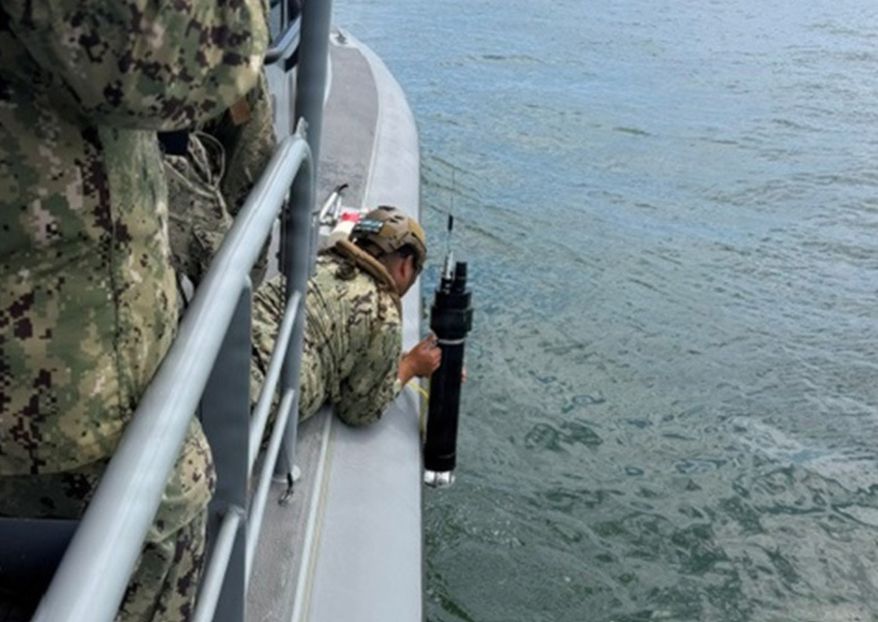 A U.S. Navy sailor employs the Hammer of the Gods emitter during Project Convergence Capstone 6 experimentation in July in southern California. (Photo courtesy of U.S. Space Force)