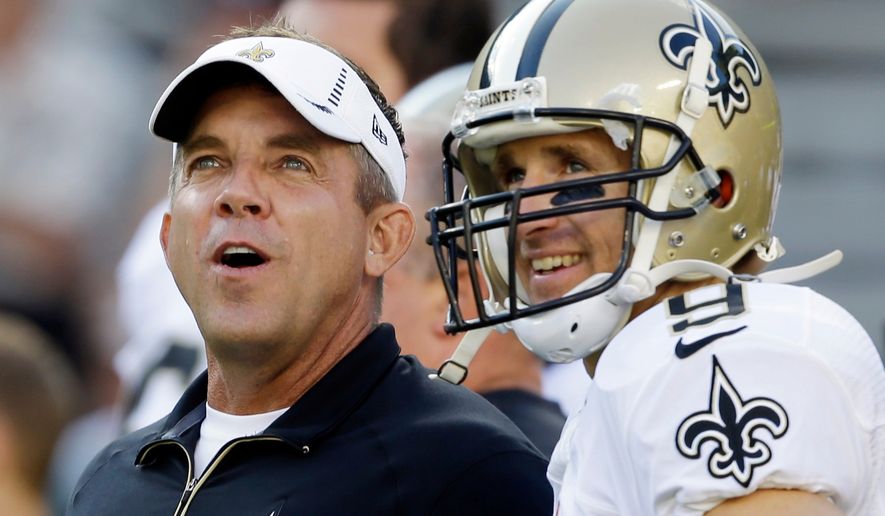 FILE - New Orleans Saints head coach Sean Payton talks to quarterback Drew Brees before a preseason NFL football game against the Green Bay Packers, Sept. 3, 2015, in Green Bay, Wis. (AP Photo/Jeffrey Phelps, File)