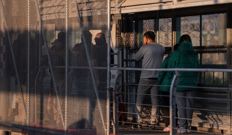 A group of undocumented migrants is deported by U.S. Immigration and Customs Enforcement agents across the McAllen-Hidalgo-Reynosa International Bridge in McAllen, Texas, March 13, 2026. (AP Photo/Felix Marquez, File)