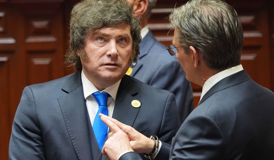 Argentina's President Javier Milei, left, talks to Bolivia's President Rodrigo Paz the inauguration of Peru's new President Keiko Fujimori in Lima, Peru, Tuesday, July 28, 2026.(AP Photo/Guadalupe Pardo, Pool)