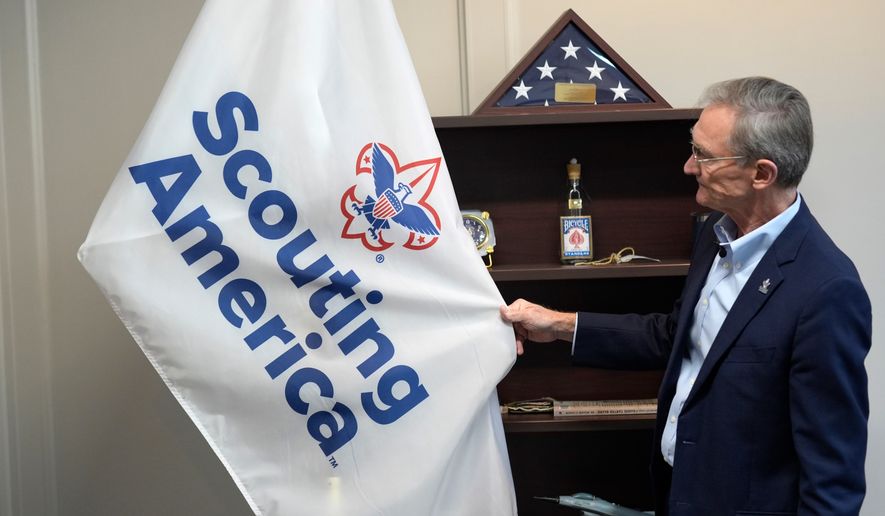 FILE - Roger Krone, chief executive officer of Scouting America, describes the design of the organization's flag in Irving, Texas, Feb. 5, 2025. (AP Photo/LM Otero, File)