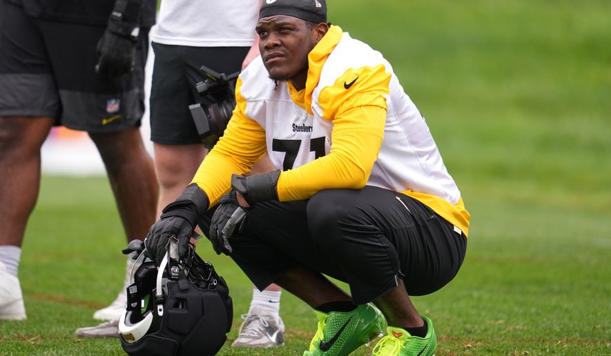 Pittsburgh Steelers offensive tackle Broderick Jones (77) takes a break during the NFL team's camp in Latrobe, Pa., Wednesday, July 29, 2026. (AP Photo/Gene J. Puskar)
