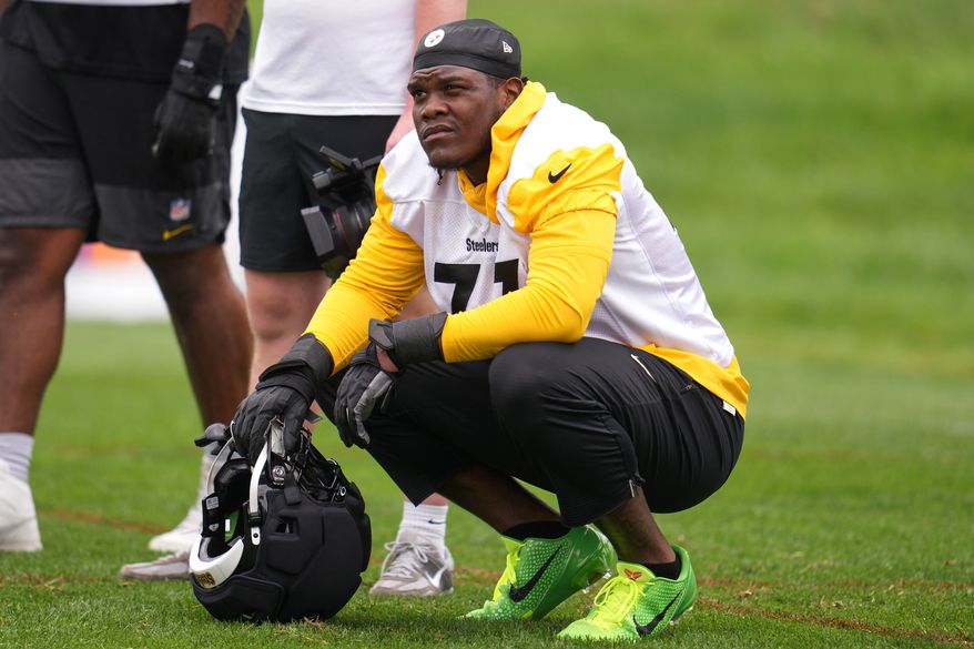 Pittsburgh Steelers offensive tackle Broderick Jones (77) takes a break during the NFL team's camp in Latrobe, Pa., Wednesday, July 29, 2026. (AP Photo/Gene J. Puskar)