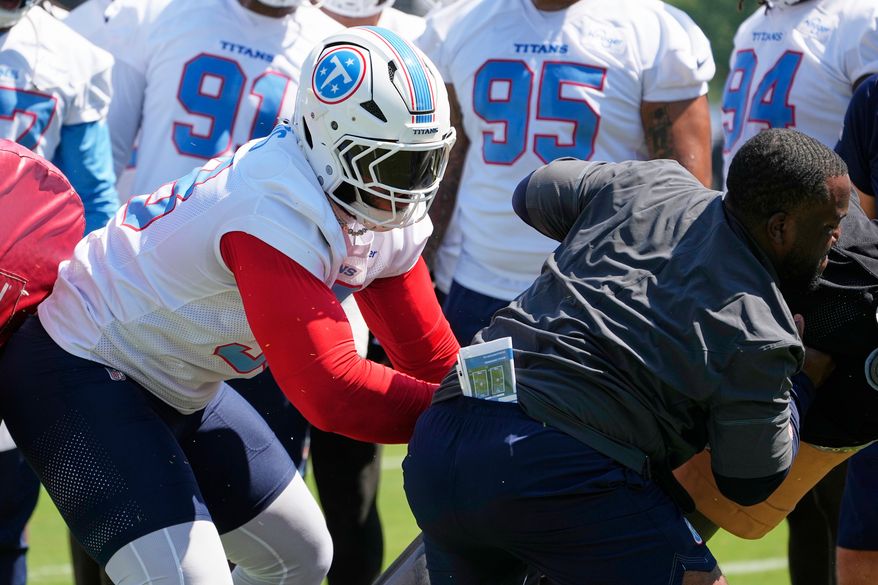 Tennessee Titans defensive tackle Jeffery Simmons runs though a drill during the NFL football team's training camp Thursday, July 30, 2026, in Nashville, Tenn. (AP Photo/George Walker IV)