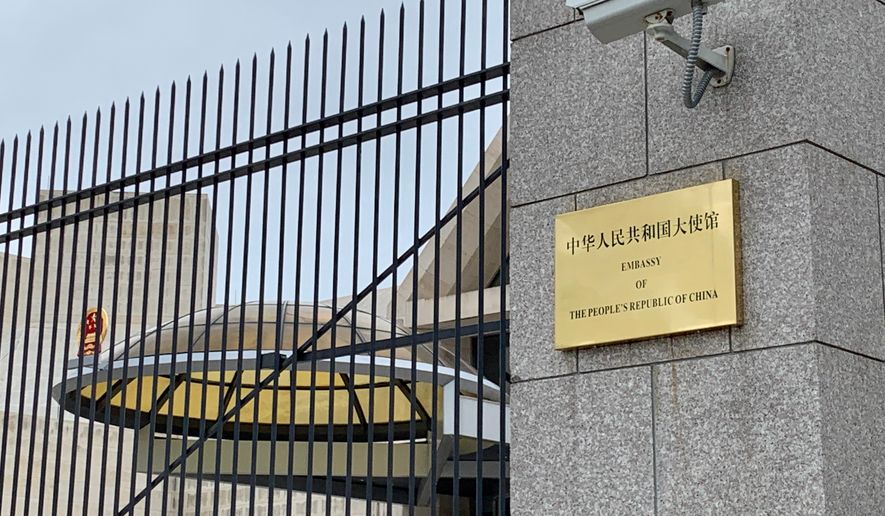 EMBASSY OF THE PEOPLE’S REPUBLIC OF CHINA - PRC - sign at embassy gate, WASHINGTON, DC - MAY 4, 2019: Photo credit: DCStockPhotography via Shutterstock.