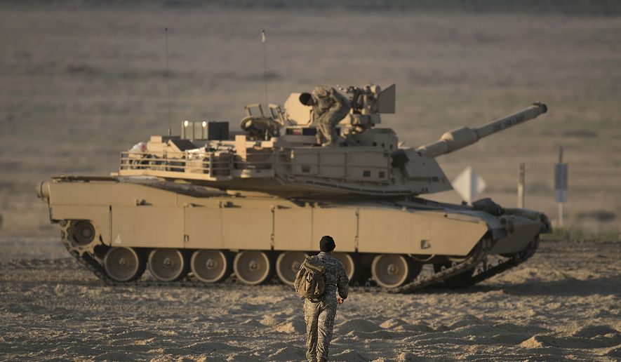 With morning light beginning to spread across the Orchard Combat Training Center’s newest Digital Air Ground Integrated Range (DAGIR), B Company tank crews begin heading toward their tanks to begin the first day of gunnery qualification. GOWEN FIELD, BOISE, IDAHO, UNITED STATES 05.17.2021. Photo by Thomas Alvarez / Idaho Army National Guard.