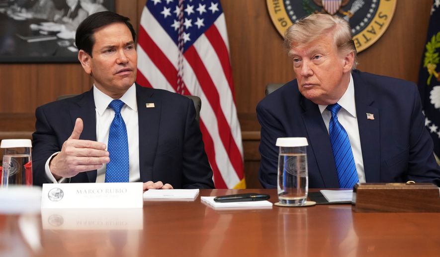 Secretary of State Marco Rubio speaks as President Donald Trump listens during a cabinet meeting, Friday, July 31, 2026, at Camp David, the presidential retreat, near Thurmont, Md., Friday, July 31, 2026. (AP Photo/Jacquelyn Martin)