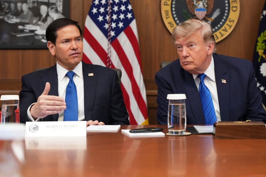 Secretary of State Marco Rubio speaks as President Donald Trump listens during a cabinet meeting, Friday, July 31, 2026, at Camp David, the presidential retreat, near Thurmont, Md., Friday, July 31, 2026. (AP Photo/Jacquelyn Martin)