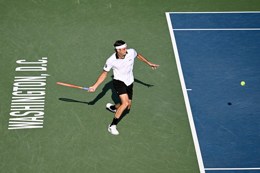 Taylor Fritz of the United States returns a shot to Alex Michelsen of the United States in a match at the DC Open tennis tournament in Washington, D.C., Friday, July 31, 2026. (All-Pro Reels)