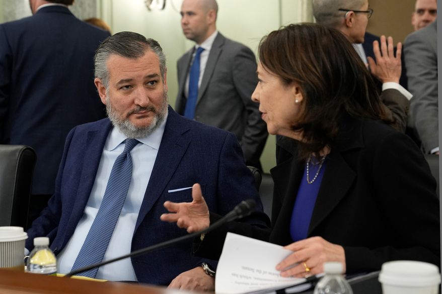 Senate Commerce, Science, and Transportation Committee Chair Sen. Ted Cruz, R-Texas, left, talks with ranking member Sen. Maria Cantwell, D-Wash., right, before the start a hearing on Capitol Hill in Washington, Wednesday, Jan. 15, 2025. (AP Photo/Susan Walsh,File)