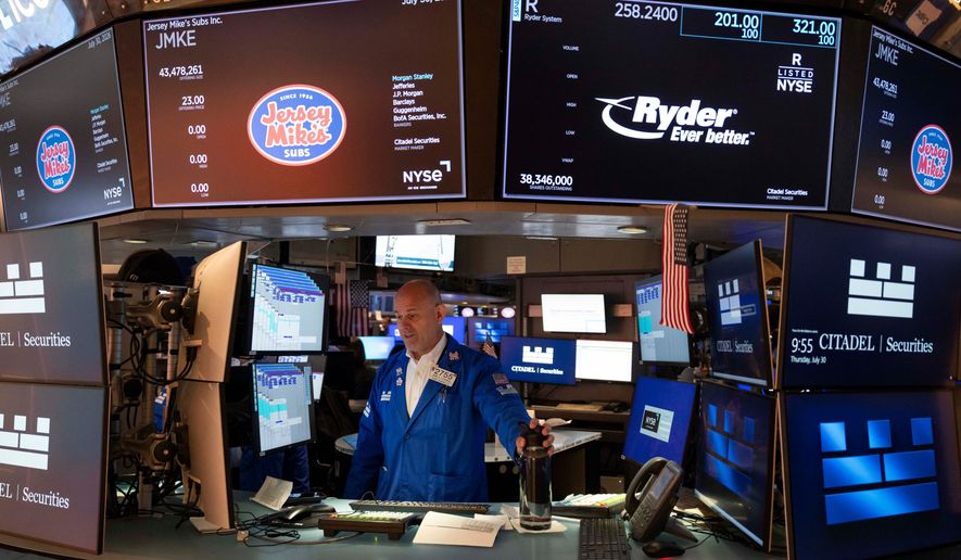 Specialist Mark Fitzgerald works on the floor of the New York Stock Exchange, Thursday, July 30, 2026, in New York. (AP Photo/Yuki Iwamura)