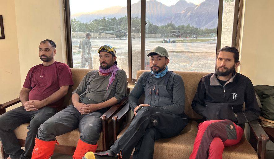 In this photo released by the Alpine Club of Pakistan on Friday, July 31, 2026, members of a mountaineers rescue team prepare to depart from an airbase on a search operation for climbers missing after an avalanche on Pakistan's Broad Peak, in Skardu, in Gilgit-Baltistan's region, in northern Pakistan. (Alpine Club of Pakistan via AP)