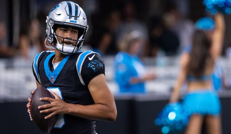 Carolina Panthers quarterback Bryce Young (9) warms up during the NFL football team's fan fest Friday, July 31, 2026, in Charlotte, N.C. (AP Photo/Scott Kinser)