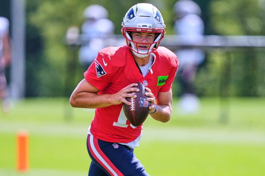 New England Patriots quarterback Drake Maye looks to pass during the team's NFL football training camp, Friday, July 31, 2026, in Foxborough, Mass. (AP Photo/Charles Krupa)