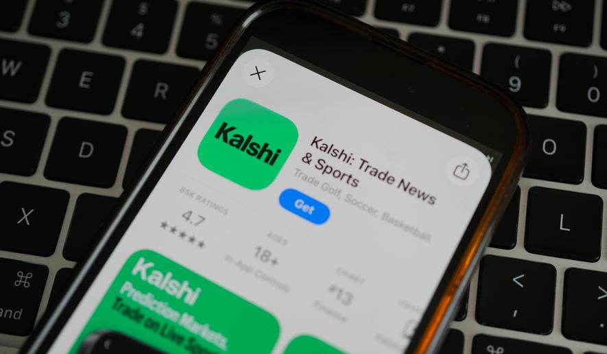 FILE - An ad for the prediction market app Kalshi is displayed on a mobile phone Thursday, April 16, 2026, in Chicago. (AP Photo/Erin Hooley, file)
