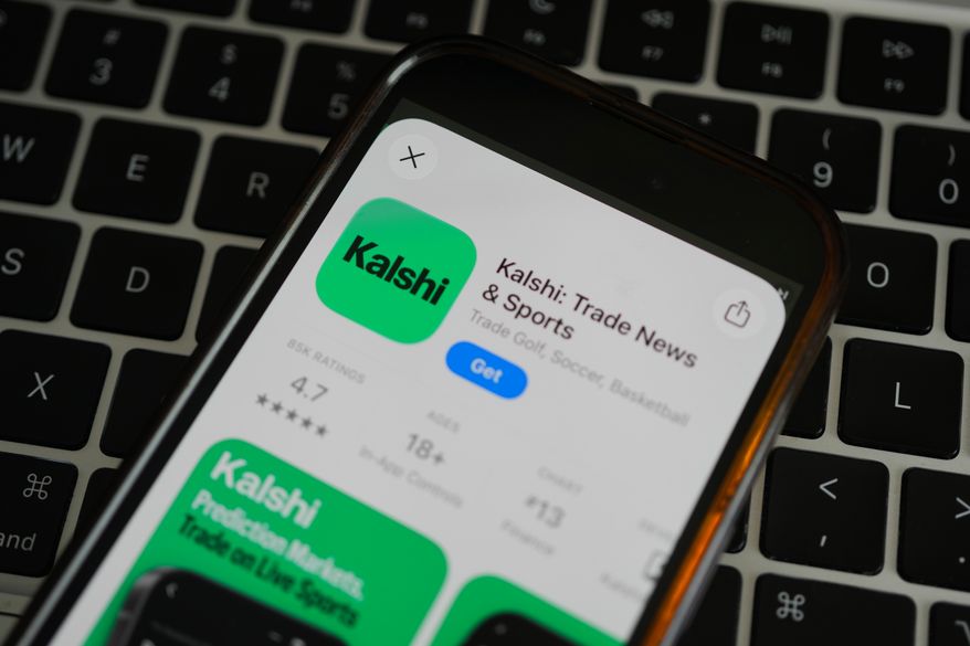 FILE - An ad for the prediction market app Kalshi is displayed on a mobile phone Thursday, April 16, 2026, in Chicago. (AP Photo/Erin Hooley, file)