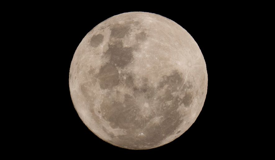 A blue moon rises in San Jose de Maipo outskirts of capital Santiago, Chile, May 30, 2026. (AP Photo/Esteban Felix, File)