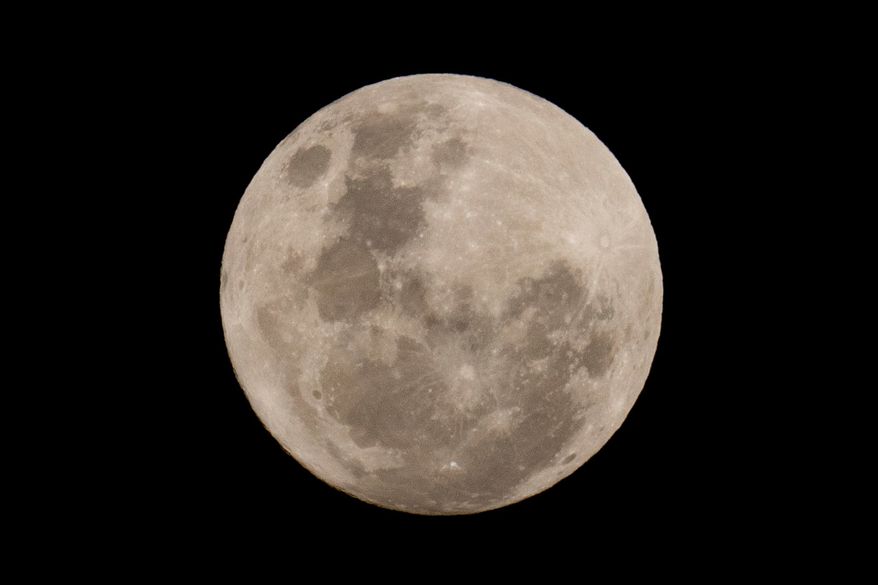 A blue moon rises in San Jose de Maipo outskirts of capital Santiago, Chile, May 30, 2026. (AP Photo/Esteban Felix, File)
