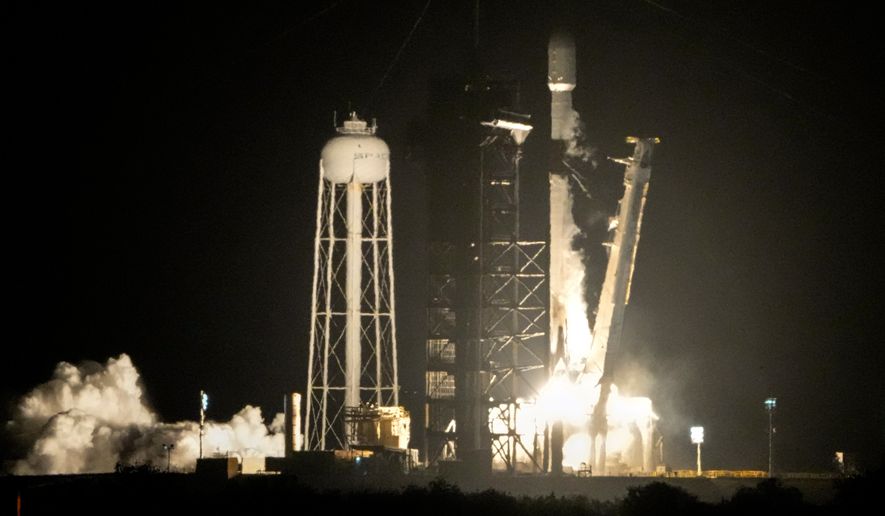 A SpaceX Falcon 9 rocket lifts off from pad 39A with a payload of a pair of lunar landers at the Kennedy Space Center in Cape Canaveral, Fla., Jan. 15, 2025. (AP Photo/John Raoux, File)