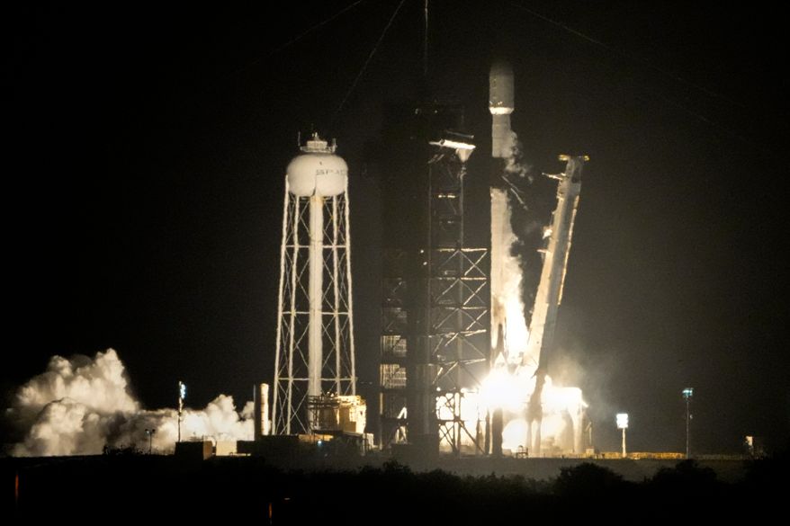 A SpaceX Falcon 9 rocket lifts off from pad 39A with a payload of a pair of lunar landers at the Kennedy Space Center in Cape Canaveral, Fla., Jan. 15, 2025. (AP Photo/John Raoux, File)