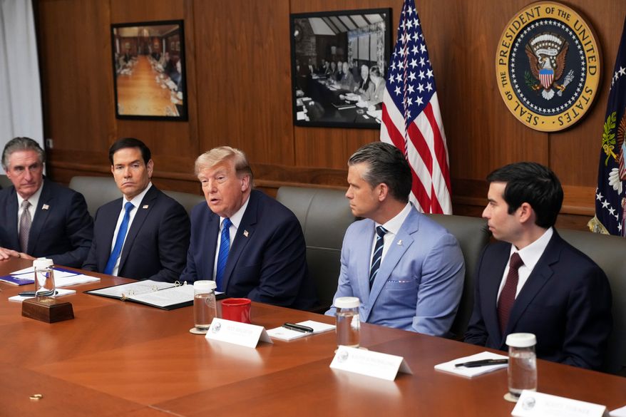 President Donald Trump, seated center, joined by Interior Secretary Doug Burgum, from left, Secretary of State Marco Rubio, Defense Secretary Pete Hegseth, and acting Labor Secretary Keith Sonderling, attends a Cabinet meeting, Friday, July 31, 2026, at Camp David, the presidential retreat, near Thurmont, Md., Friday, July 31, 2026. (AP Photo/Jacquelyn Martin)