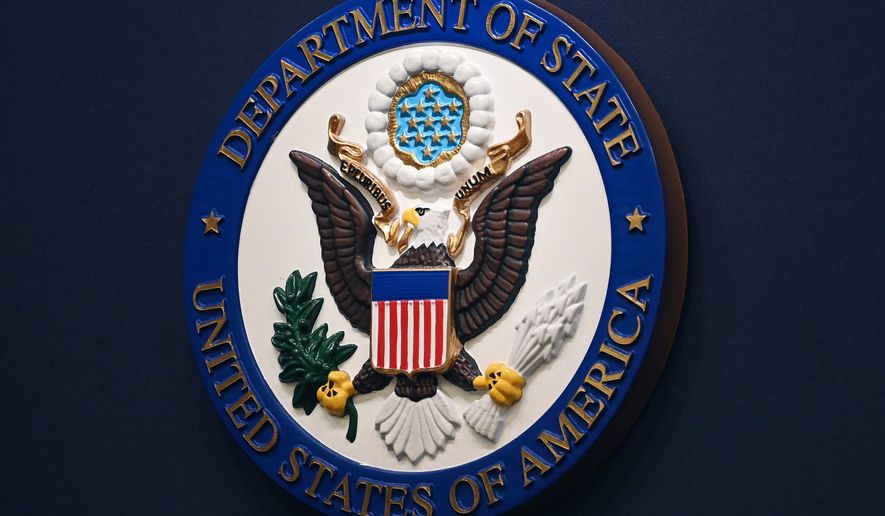 FILE - The State Department seal is seen on the briefing room lectern at the State Department in Washington, Jan. 31, 2022. (Mandel Ngan, Pool via AP, File)