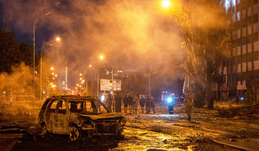 A burned car is seen after a Russian missile attack in Kyiv, Ukraine, Saturday, Aug. 1, 2026. (AP Photo/Dan Bashakov)