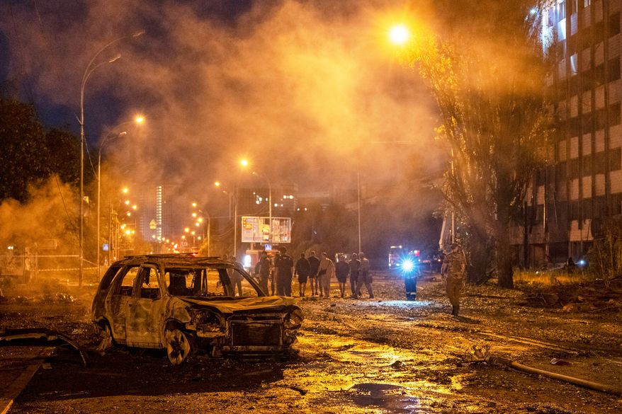 A burned car is seen after a Russian missile attack in Kyiv, Ukraine, Saturday, Aug. 1, 2026. (AP Photo/Dan Bashakov)