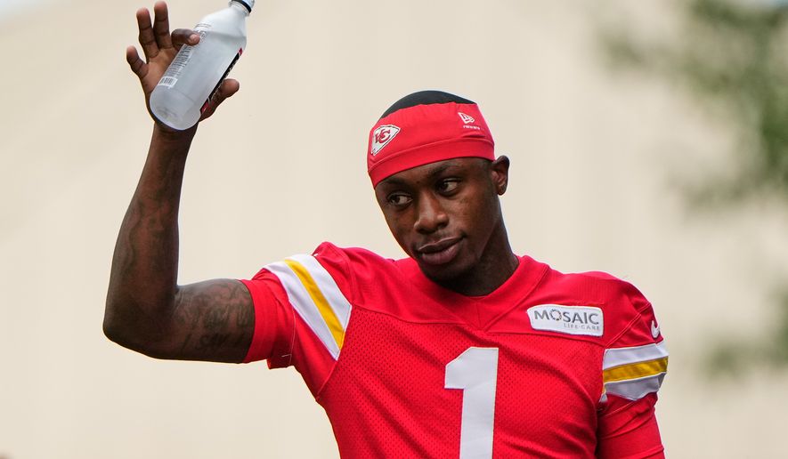 Kansas City Chiefs wide receiver Xavier Worthy waves to fans as he arrives at NFL football training camp Friday, July 31, 2026, in St. Joseph, Mo. (AP Photo/Charlie Riedel)