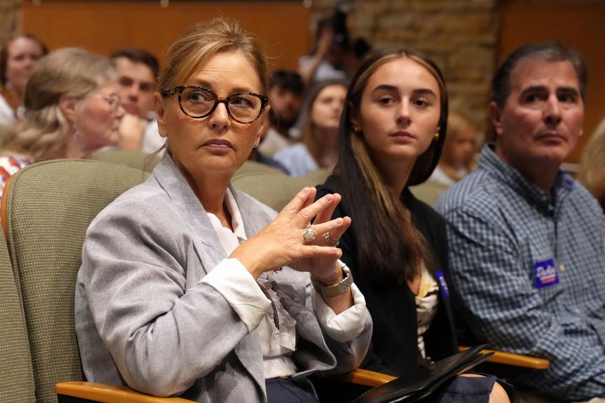 Sen. Darline Graham, R-S.C., from left, seated alongside daughter Nicole Nordone and husband Larry Nordone, looks on as a South Carolina Republican Senate candidate stump event gets underway ahead of the special GOP primary to replace her late brother, Sen. Lindsey Graham, R-S.C., Saturday, Aug. 1, 2026, in Lexington, S.C. (AP Photo/Meg Kinnard)