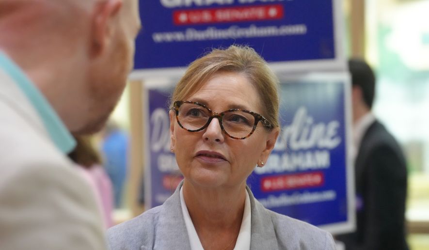 Sen. Darline Graham, R-S.C., speaks with voters following a Senate candidate stump event ahead of a special GOP primary to select a replacement for her late brother, Sen. Lindsey Graham, Saturday, Aug. 1, 2026, in Lexington, S.C. (AP Photo/Meg Kinnard)