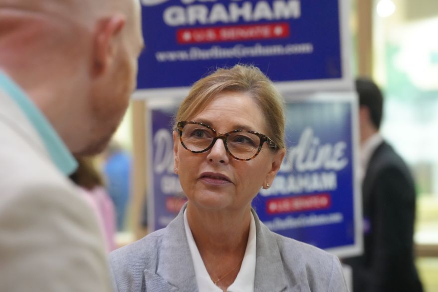 Sen. Darline Graham, R-S.C., speaks with voters following a Senate candidate stump event ahead of a special GOP primary to select a replacement for her late brother, Sen. Lindsey Graham, Saturday, Aug. 1, 2026, in Lexington, S.C. (AP Photo/Meg Kinnard)