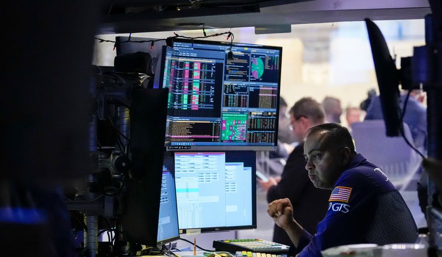 Specialist Dilip Patel works on the floor of the New York Stock Exchange, Thursday, July 30, 2026, in New York. (AP Photo/Yuki Iwamura) ** FILE **