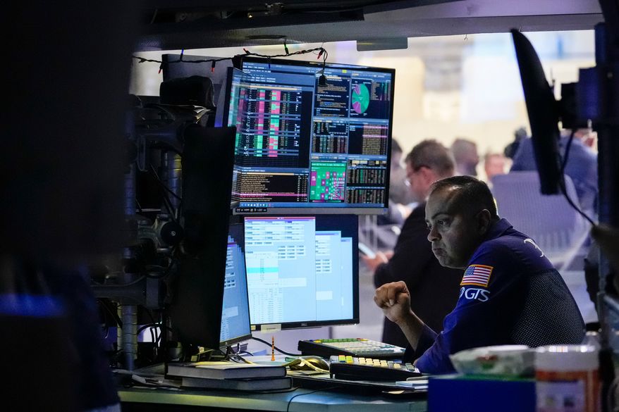 Specialist Dilip Patel works on the floor of the New York Stock Exchange, Thursday, July 30, 2026, in New York. (AP Photo/Yuki Iwamura) ** FILE **