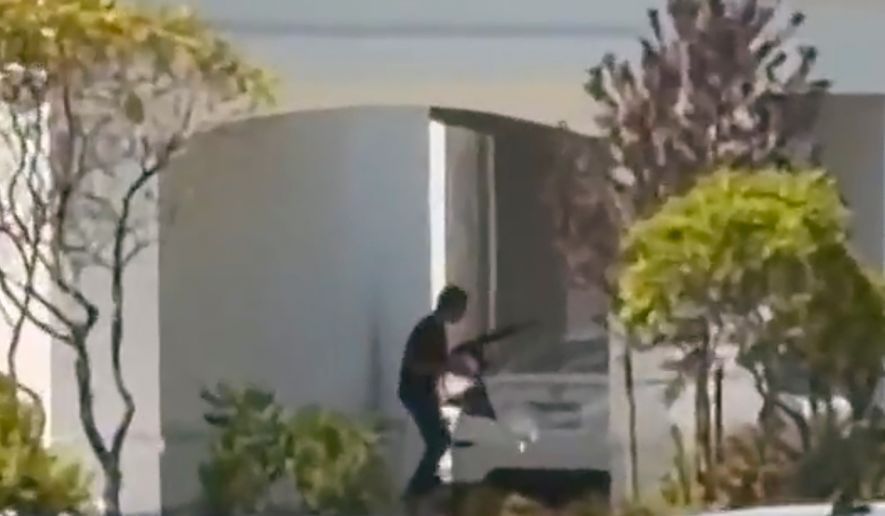 This still image captured from video by a witness shows the scene of a shooting that started at an In-N-Out Burger restaurant, Saturday, Aug. 1, 2026 in Twin Falls, Idaho. (Kevin Bell Jr. via AP)