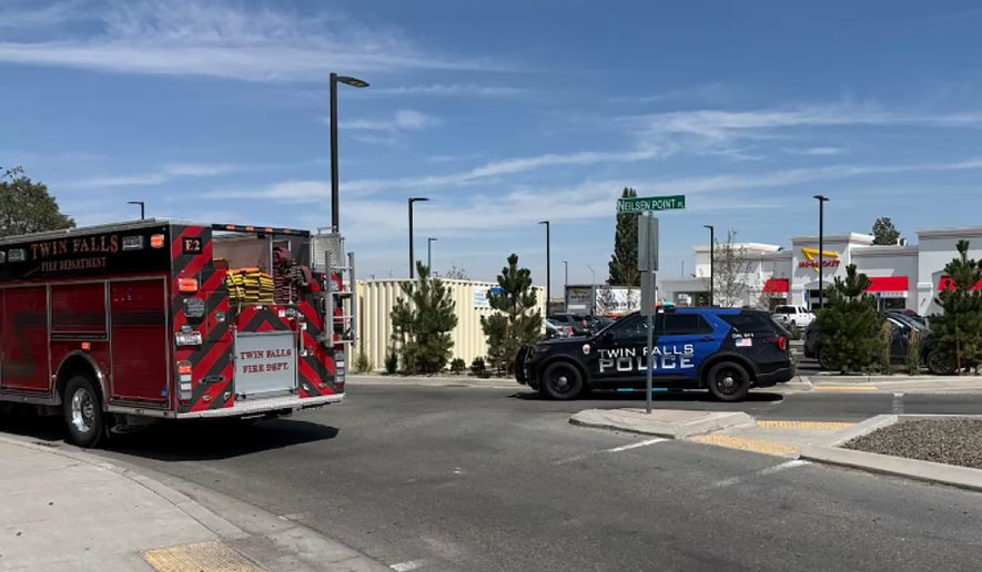 This image provided by KMVT shows the scene of a shooting that started at an In-N-Out Burger restaurant, Saturday, Aug. 1, 2026 in Twin Falls, Idaho. (KMVT via AP)