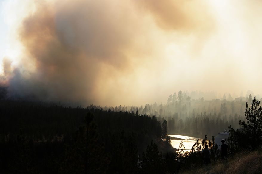 Old Trails Fire is seen from W. Northwest Blvd., Saturday, Aug. 1, 2026, in Spokane, Wash. (AP Photo/Young Kwak)