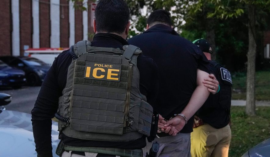 U.S. Immigration and Customs Enforcement agents make an arrest during an early morning operation in Park Ridge, Ill., Sept. 19, 2025. (AP Photo/Erin Hooley, File)