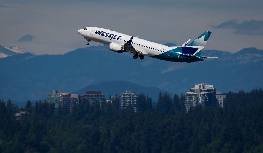 A WestJet Boeing 737 Max aircraft takes off from Vancouver International Airport in Richmond, British Columbia, Canada, on Friday, July 31, 2026. (Darryl Dyck/The Canadian Press via AP)